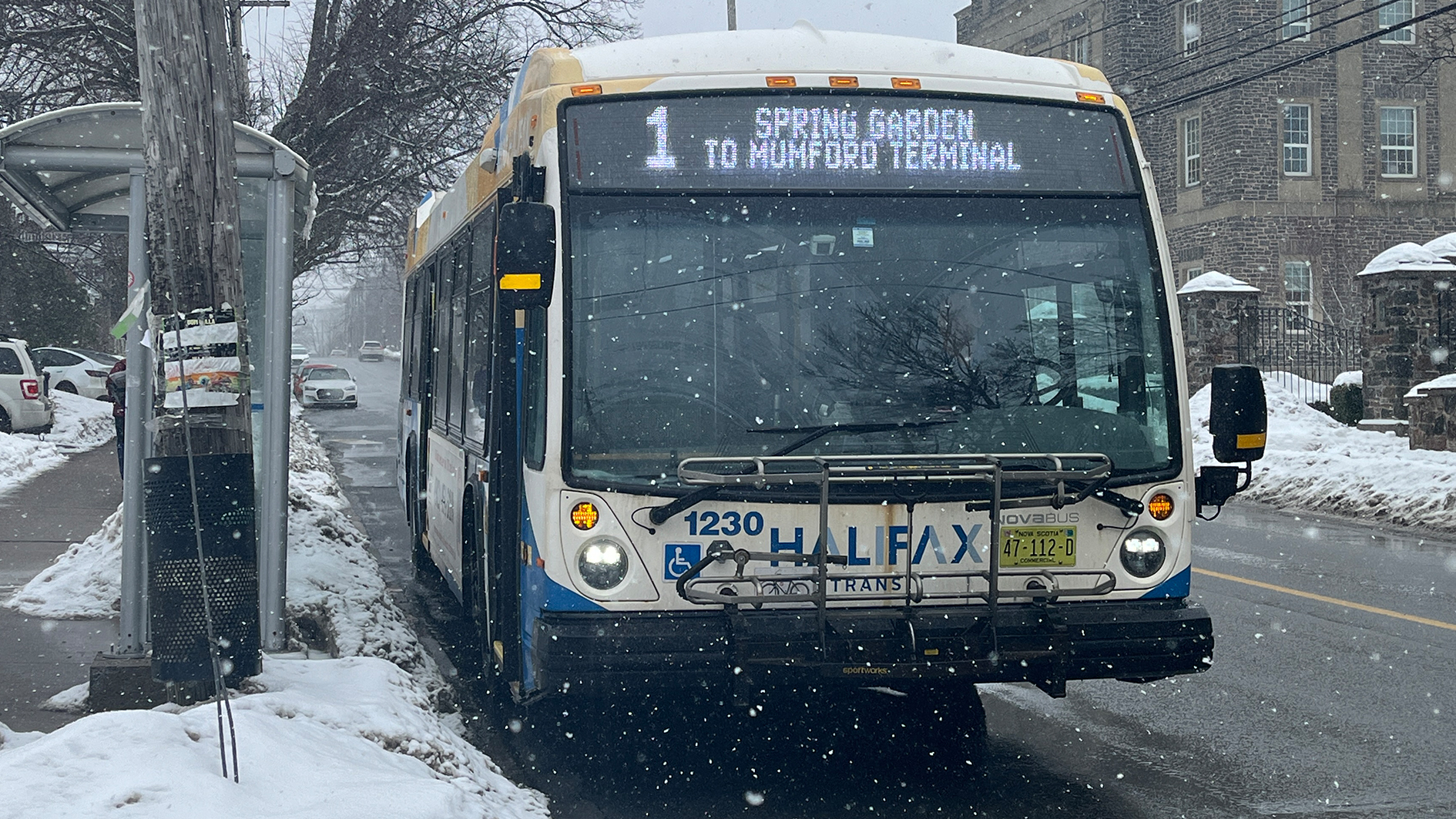 The 1 bus in Halifax, Nova Scotia is stopping at the side of the road to let people on