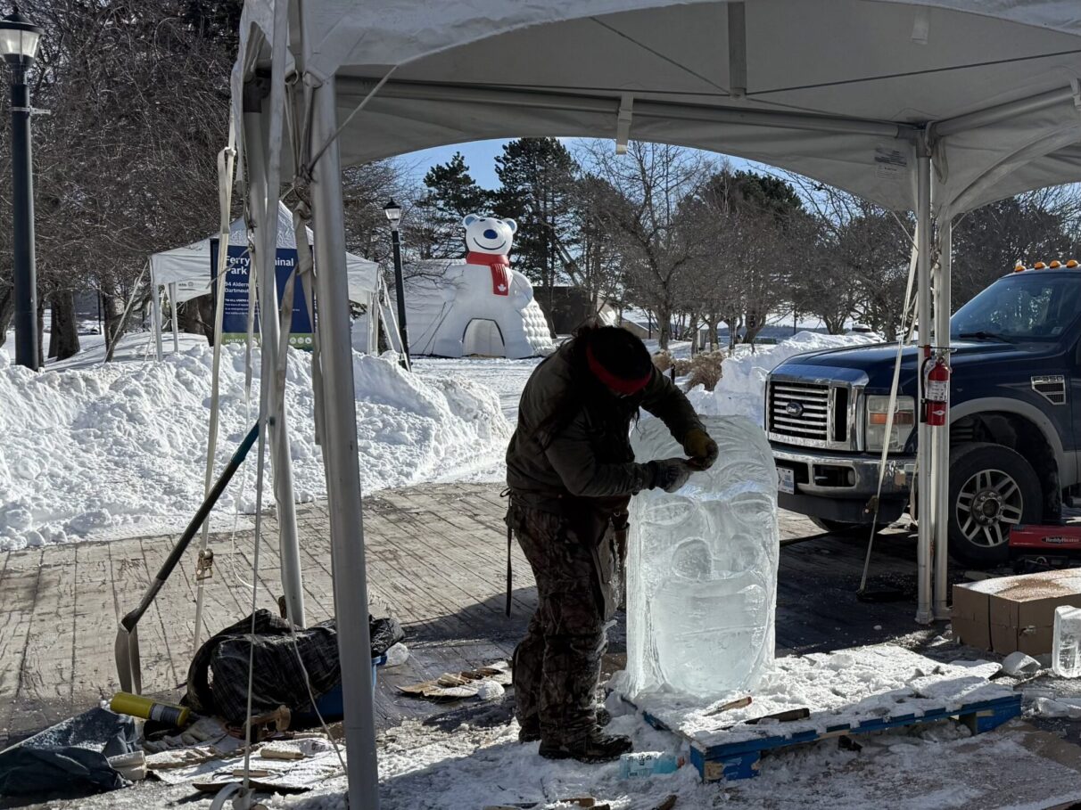Carver Gordon Sparks (New Brunswick) carves an ice sculpture at Ferry Terminal Park, Jan 30.