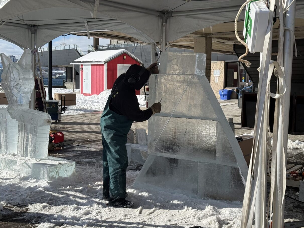 Ice carver carving ice.