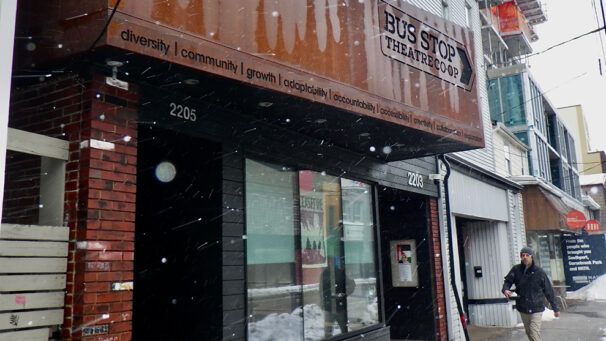 A man walking outside the Bus Stop Theatre Co-op in Halifax’s North End.