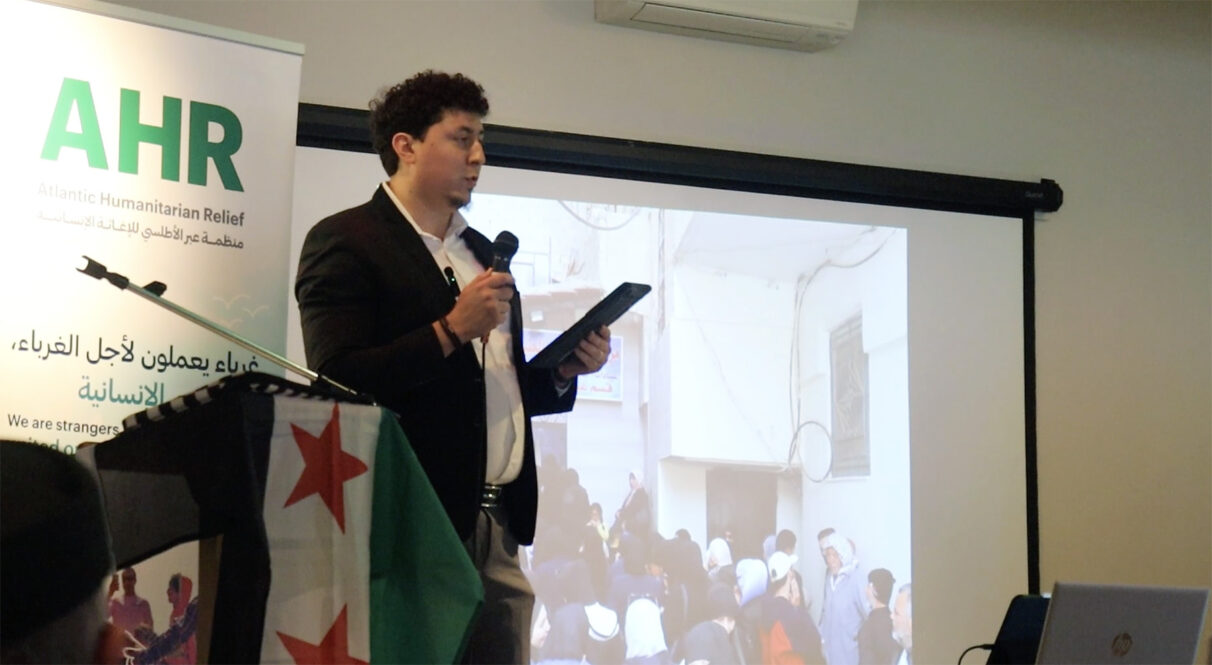 Atlantic Humanitarian Relief representative Abdulkarim Angel tells attendees about plans to renovate orphanages in Damascus, Aleppo and Homs, Syria. AHR also announced fundraising efforts to provide hearing aids for deaf people.