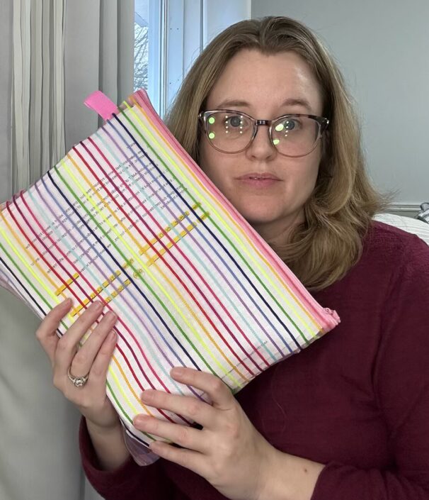 Aimee Terrio holds the binder where she organized the bills, records and paperwork from her fertility journey. Photo contributed by Aimee Terrio.