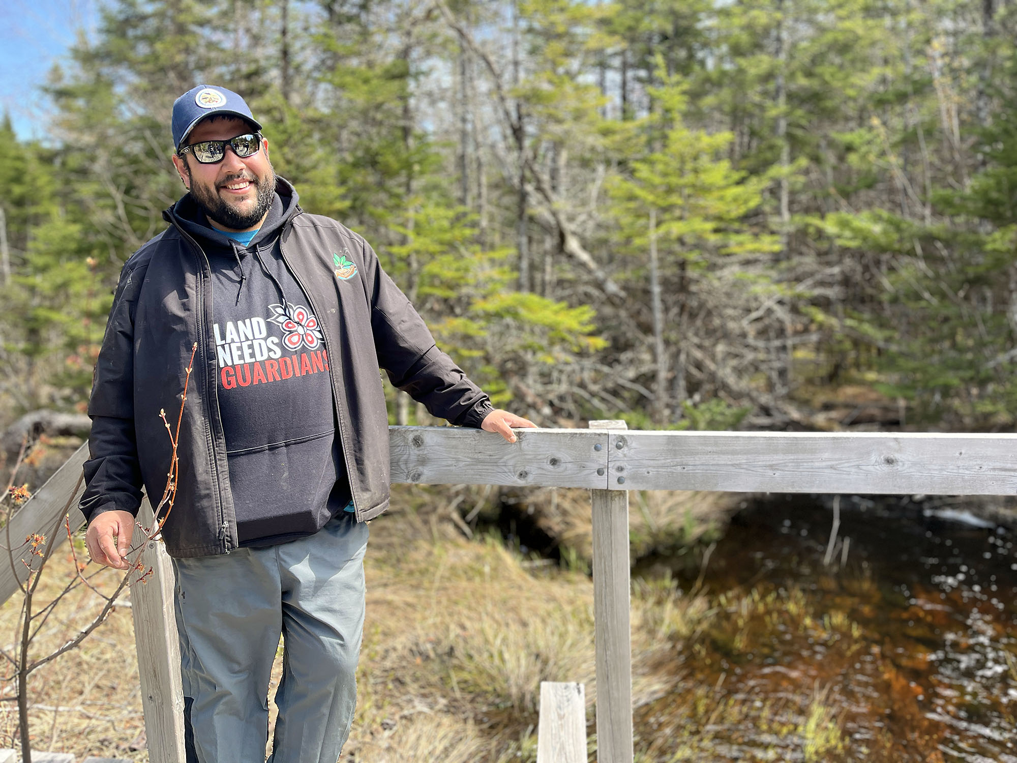 Jordan Marshall, a Land Guardian with Eskasoni Fish and Wildlife Commission, overlooks a wetlands area in the hills above Eskasoni First Nation, N.S.